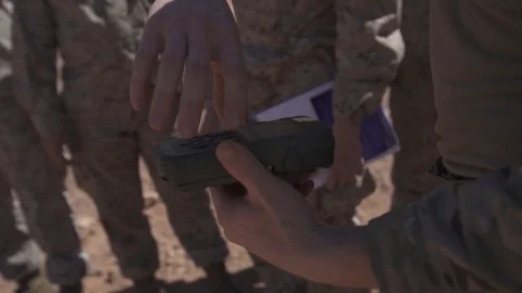 Soldier using handheld computer during close air support exercise Stock Footage 106381888