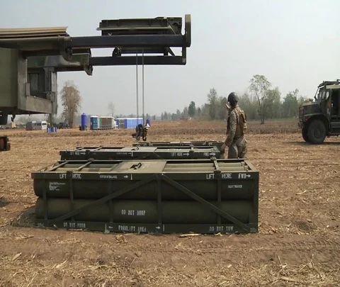 Soldier using hoist to load ammunition into HIMARS during Cobra Gold Видео 102944365