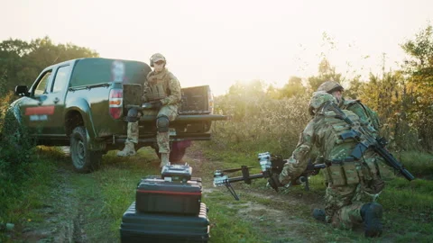 Soldier using laptop computer for surveillance during a military operations Stock Footage 241010141