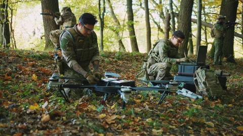 Soldier using laptop computer for surveillance during a military operations in Video stock 241556221