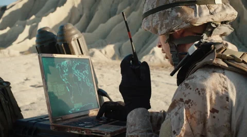 Soldier is Using Laptop Computer for Tracking the Target and Radio Video stock 68998820