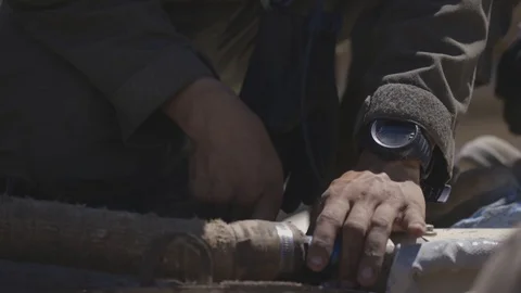 Soldier using spanner on tank Stock Footage 109604459