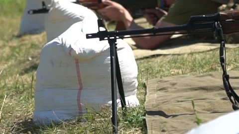 Soldier waiting for a shot from a machine gun ak 47. Stock Footage 201427705