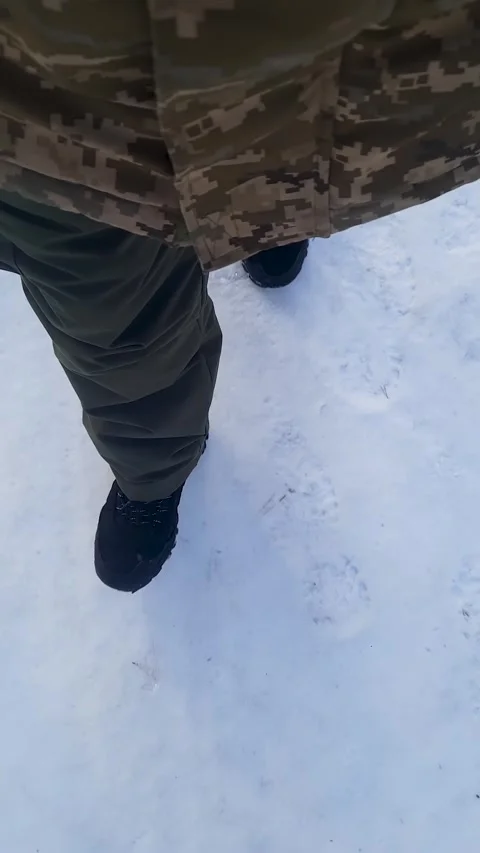 Soldier Walking Through Snow Close Up Military Boots 動画素材 329892482