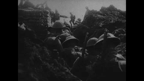 Soldier walking through trenches and digging through trenches with picks - 1918 Stock Footage 98249574