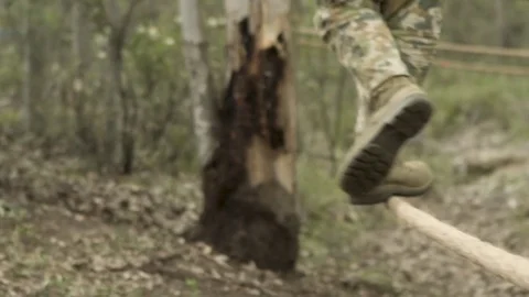 Soldier walking on tight rope Video stock 77019724