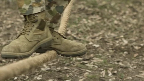 Soldier walking on tight rope Stock Footage 77019806