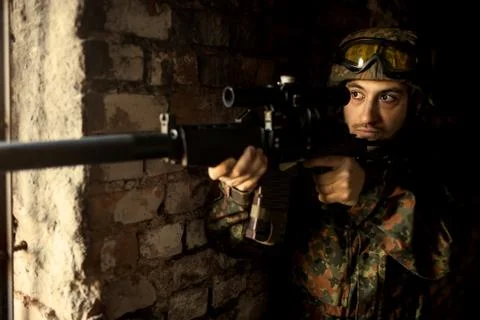 Soldier in the war to aim with weapons Stock Photos