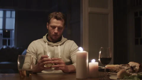 A soldier with the war trauma thinking about something at the table And loo.. Stock Footage 264329380
