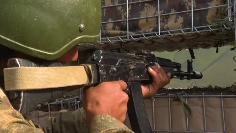 Soldier Watching/Foloowing an enemy post Stock Footage 224150178