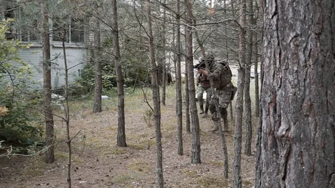 The soldier is wounded. airsoft. 4k Stock Footage 124711063