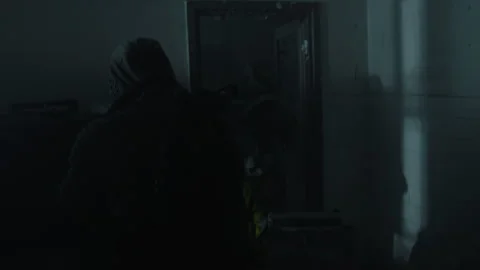 Soldiers in an abandoned building using flashlights to find somebody Stock Footage 259749403