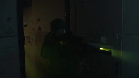 Soldiers in an abandoned building using flashlights Stock Footage 259750187