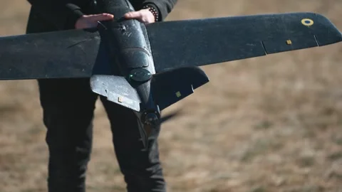 Soldiers are preparing to launch drones in a field, testing engine and Stock Footage 276531771