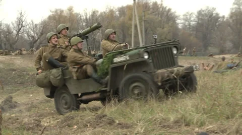 Soldiers attack the enemy. Firearms are used, tanks and heavy weapons. Stock Footage 33835147