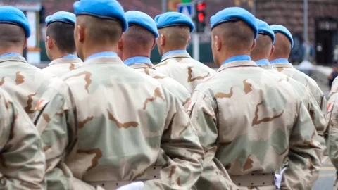 Soldiers in blue berets waiting for command Stock Footage 79341506