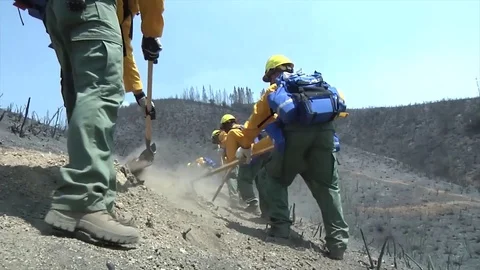 Soldiers cutting lines to prevent spread of Washington wild fire Stock Footage 93732367