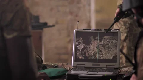 Soldiers detecting enemy on map at army laptop Video stock 138143812