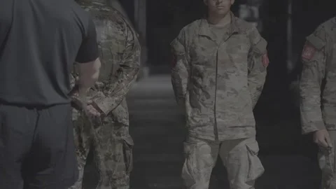 Soldiers getting drenched with a hose during the Ranger Assessment and Selection Stock Footage 295033794