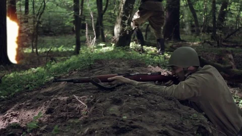 Soldiers go on the attack in the forest. World War II. Video stock 74594583