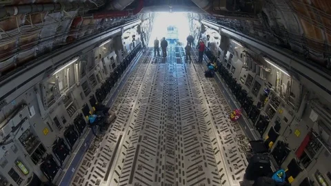 Soldiers load fire engine in Boeing C-17 Globemaster III - 2018 Stock Footage 94409332