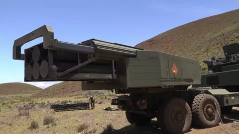 Soldiers loading missiles onto High Mobility Artillery Rocket System HIMARS Stock Footage 201928274
