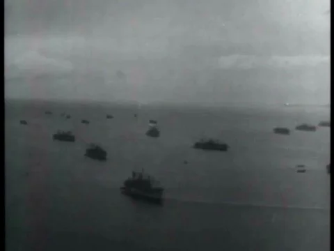 Soldiers march through hills and meet villagers and warships wait as divers Stock Footage