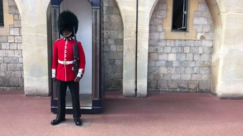 Soldiers Marching on the grounds of Windsor Castle Stock Footage 136636622