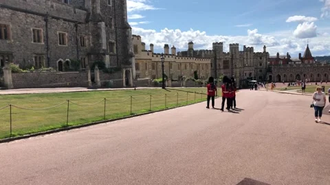 Soldiers Marching on the grounds of Windsor Castle Stock Footage 136637129