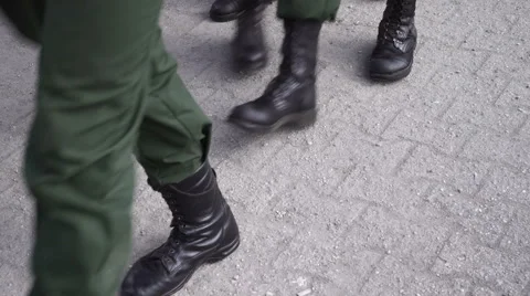 Soldiers marching through the city Stock Footage 62948975