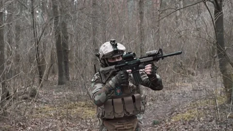 Soldiers move through the forest Stock Footage 131093388