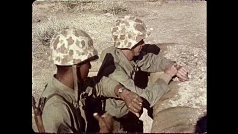 Soldiers observe a spectacular 1951 atomic bomb test at the Nevada Proving Stock Footage 106905879
