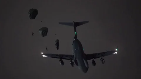 Soldiers parachuting from a Lockheed C-5M Super Galaxy 1 Video stock 113345670