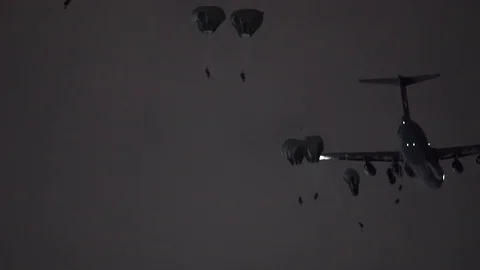 Soldiers parachuting from a Lockheed C-5M Super Galaxy 2 Video stock 113345681