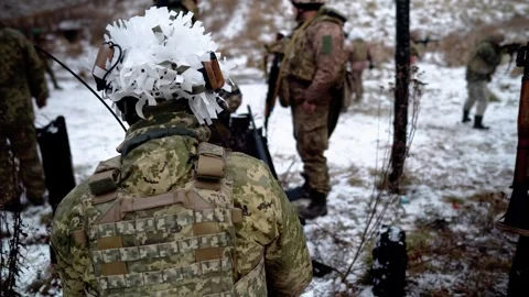 Soldiers practice shooting with machine guns on a military field Stock Footage 288825680