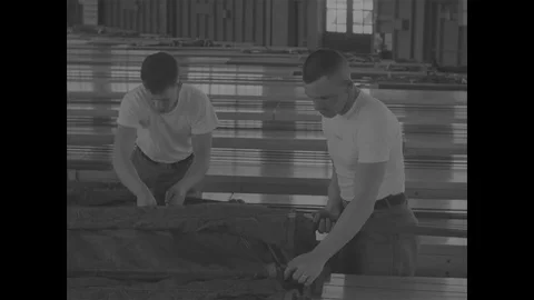 Soldiers practicing how to fold the canopy of a parachute - 1967 스톡 동영상 118316145