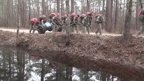 Soldiers pulling trailer during Special Forces Selection exercise Stock-Footage 98347794