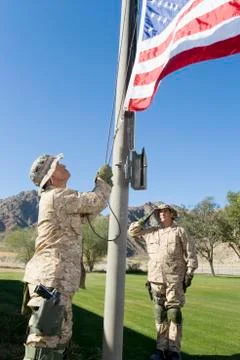 Soldiers Raising United States Flag Stock Photos