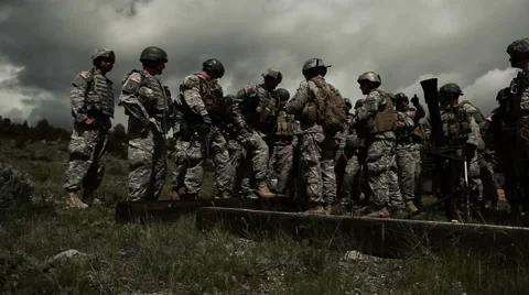 Soldiers receiving instruction at mortar range; panning right. Stock Footage 52702884