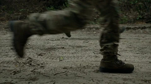 Soldiers run through the forest. Close Up. Partisan Detachment. Video stock 107784104