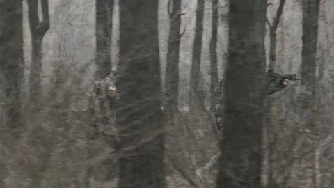 Soldiers run through the forest Stock Footage 131092887