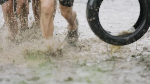 Soldiers running thought mud Stock Footage 77018445
