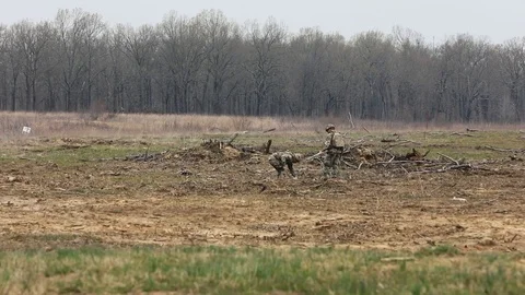 Soldiers set explosives and explode them in an open field Stock Footage 114019491