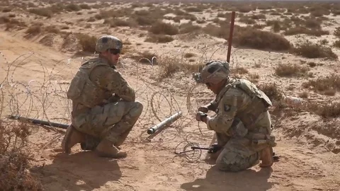 Soldiers setting explosives charge in desert during exercise African Lion Stock Footage 105646747