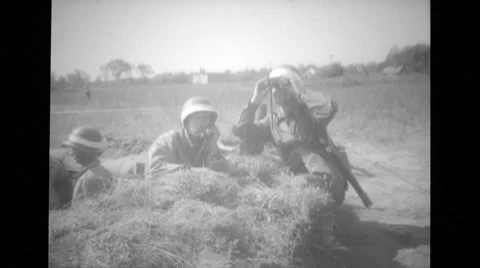 Soldiers talking and looking through binoculars in the field Stock Footage 37390005