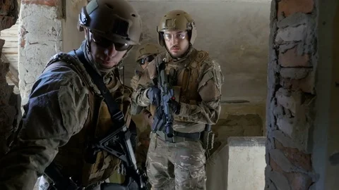 Soldiers team wearing shotguns listening orders from commander before the ope Stock Footage
