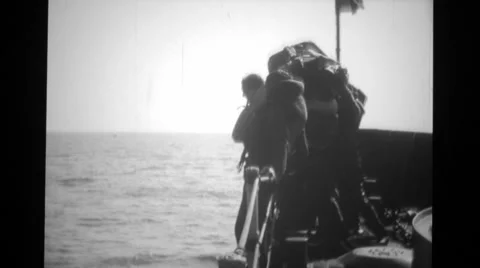 Soldiers throwing lifeboat and jumping in sea Stock Footage