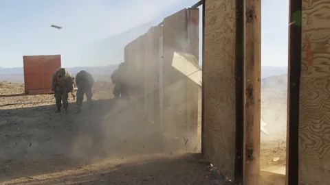 Soldiers train blowing a door going in with assault rifles 1 Stock Footage 110826071