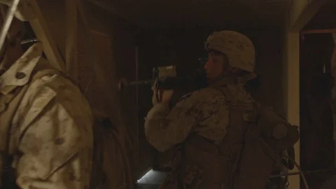 Soldiers train tactics on inside a building on military compound Stock Footage 112159940