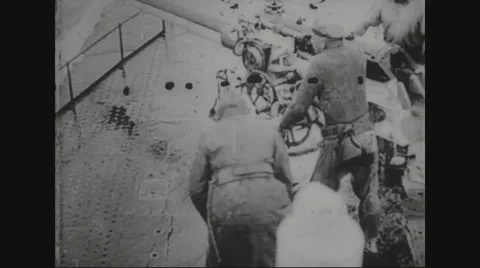 Soldiers on u-boat preparing to fire on steamer Stock Footage